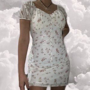 white flower dress and slight puff short sleeves.